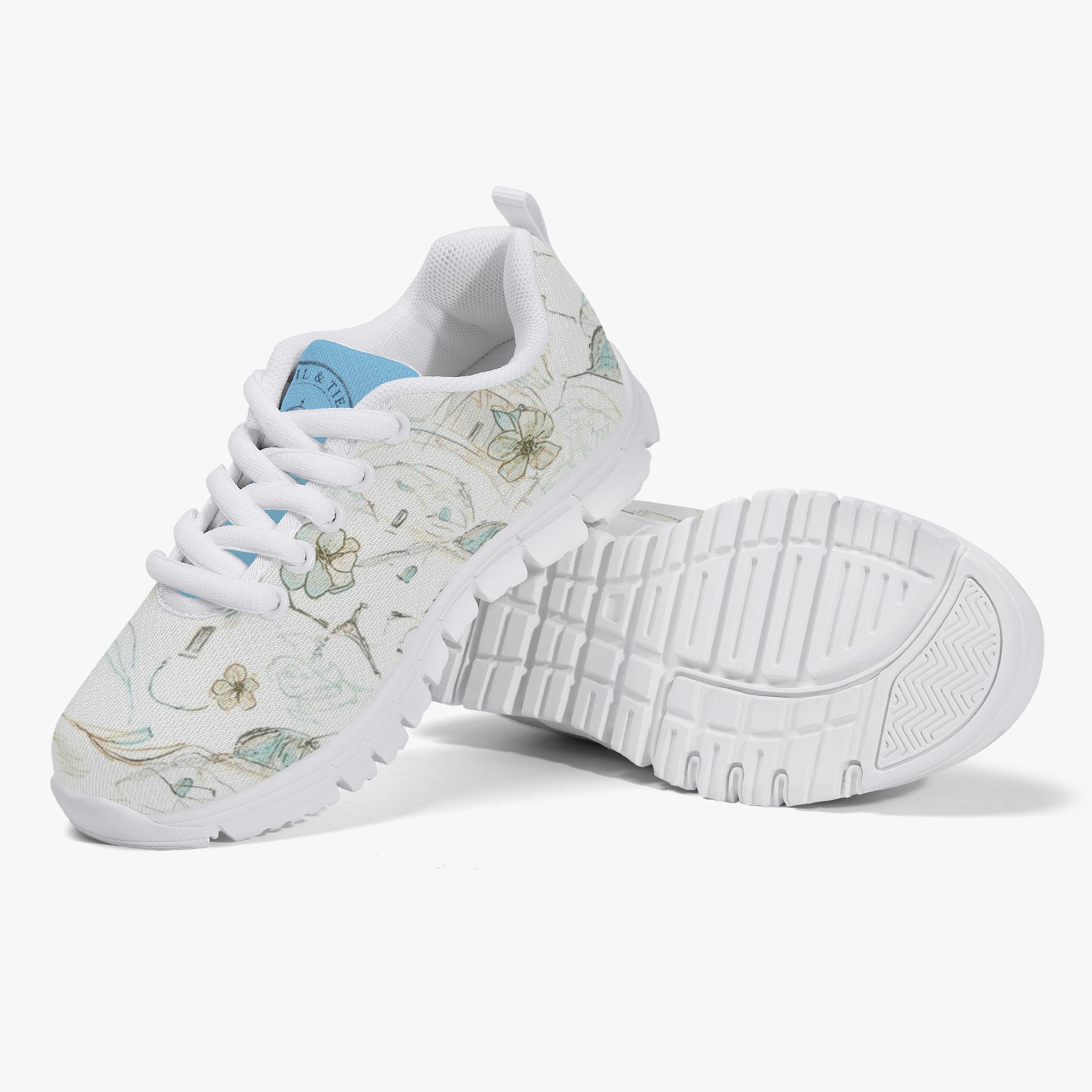 Girls’ Santorini Travel Sneakers featuring a floral design with white sole and breathable mesh upper.