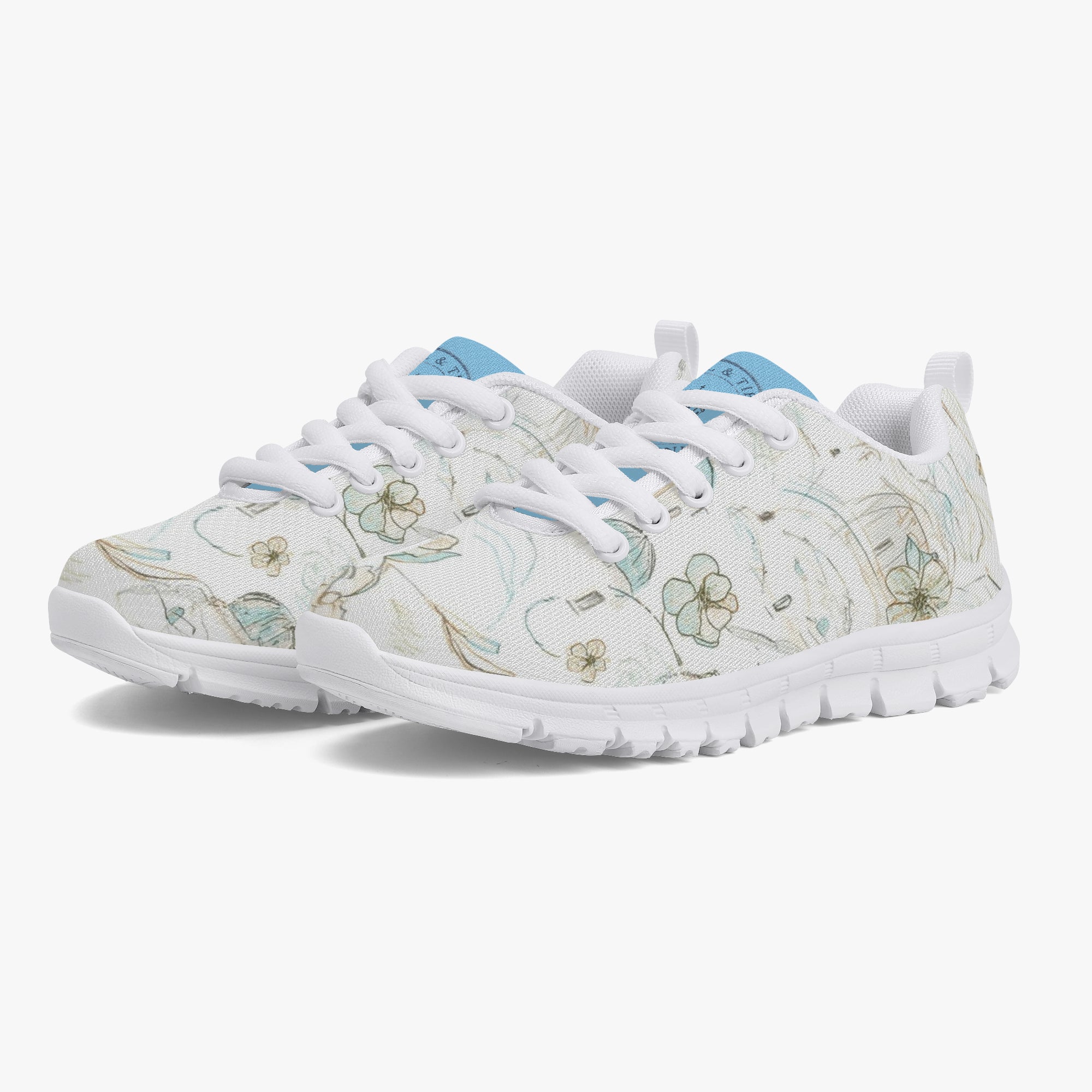 Girls’ Santorini Travel Sneakers in white with floral design and blue accents for stylish comfort.